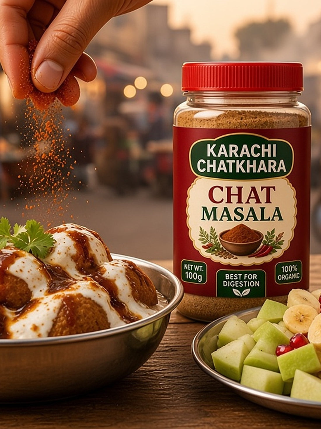 Chat Masala sprinkled over dahi baray and fruit chaat, Karachi street food style